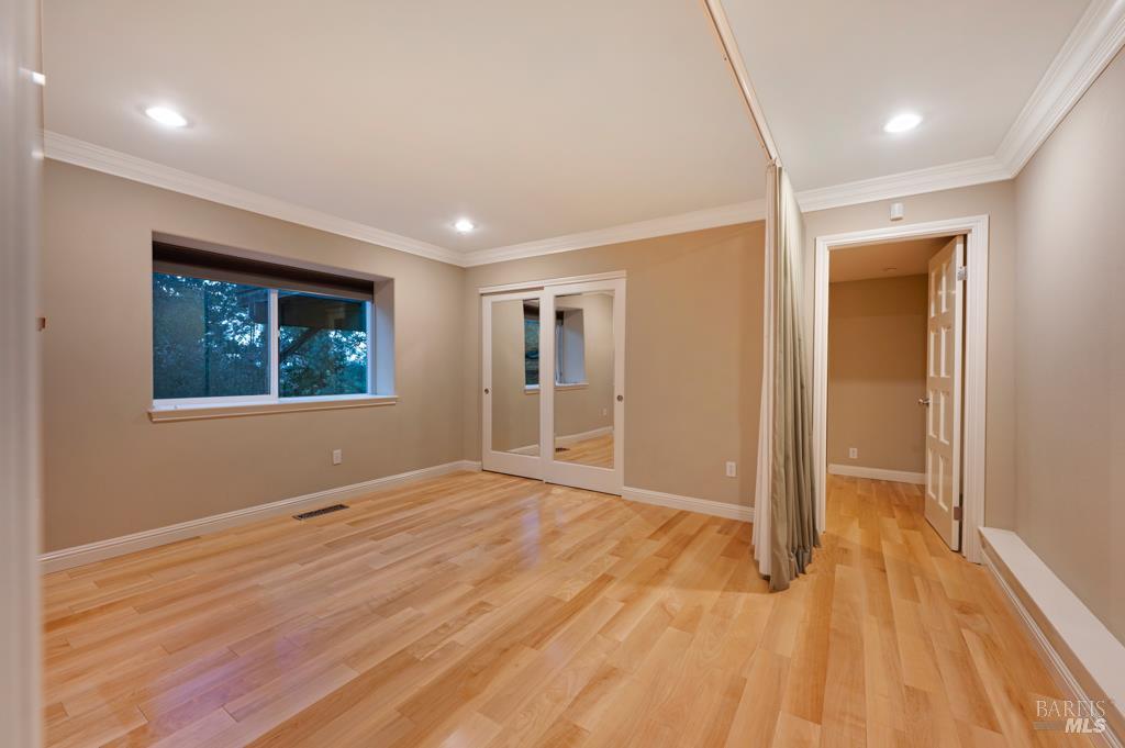 2531 Del Rosa Avenue Santa Rosa, CA 95404 - Photo 25 of 41 a view of an empty room with wooden floor and a window