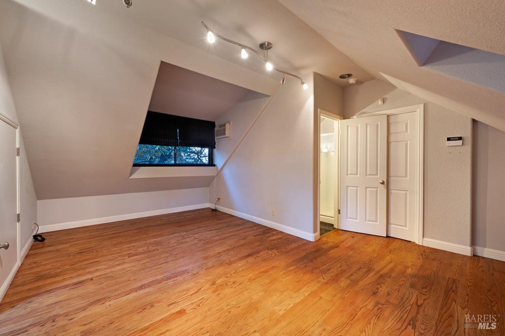 2531 Del Rosa Avenue Santa Rosa, CA 95404 - Photo 34 of 41 a view of an empty room with wooden floor and a window