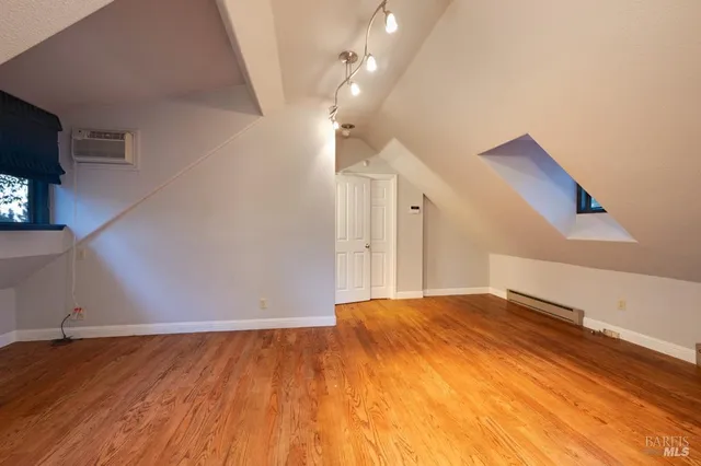 a view of a livingroom with wooden floor