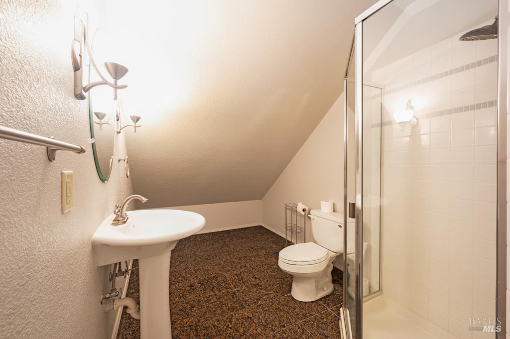 2531 Del Rosa Avenue Santa Rosa, CA 95404 - Photo 36 of 41 a white toilet sitting next to a bathroom sink