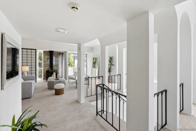a living room with furniture and a lamp