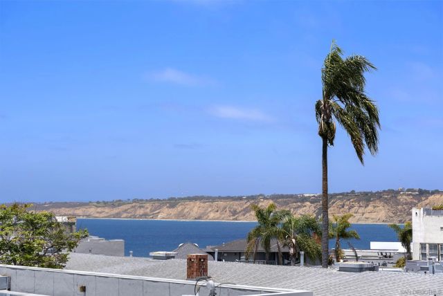 a view of a patio with couches and a fire pit