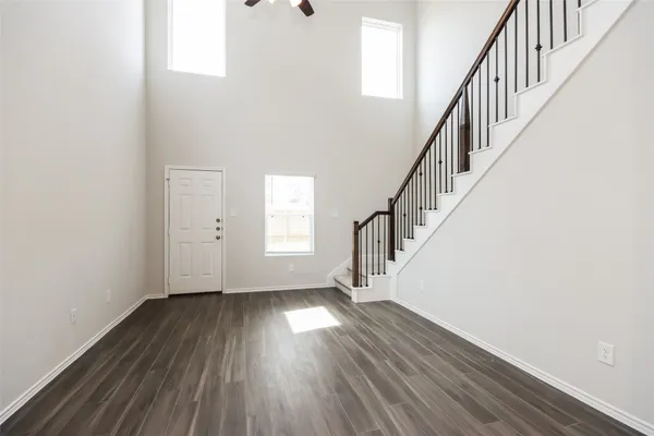 a view of an entryway with wooden floor