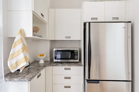 a kitchen with stainless steel appliances a refrigerator and a sink