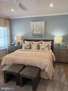 a bedroom with a bed and a lamp