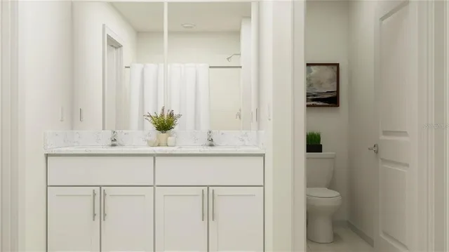 a bathroom with a sink a toilet and a mirror