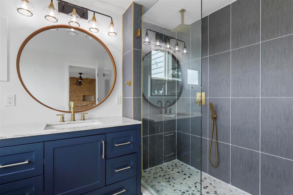 8048 Woodvale Road Fort Worth, TX 76135 - Photo 15 of 27 Bathroom with a shower with shower door and vanity