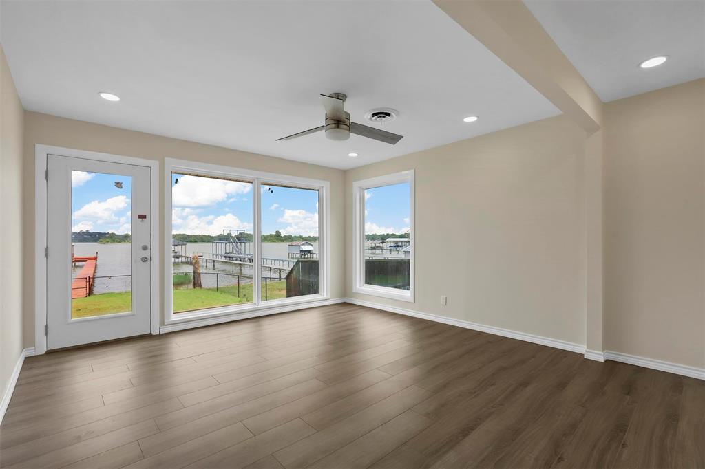 8048 Woodvale Road Fort Worth, TX 76135 - Photo 19 of 27 Unfurnished room featuring hardwood / wood-style flooring and ceiling fan