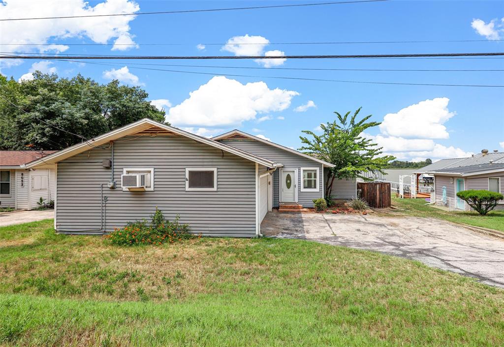 8048 Woodvale Road Fort Worth, TX 76135 - Photo 4 of 27 View of front facade featuring a front yard