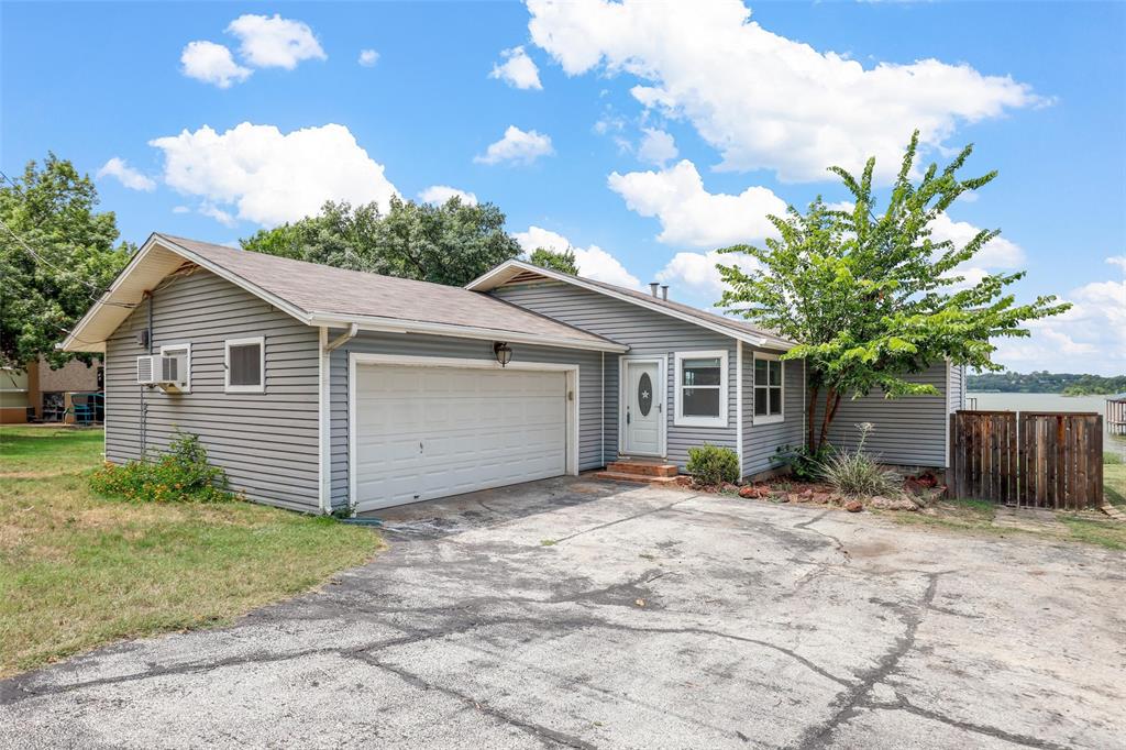 8048 Woodvale Road Fort Worth, TX 76135 - Photo 6 of 27 Ranch-style house with a garage and a front lawn