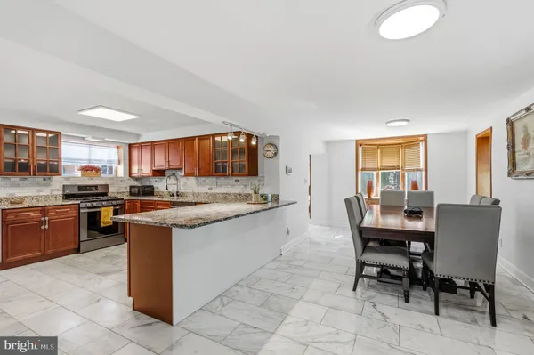 a kitchen with granite countertop breakfast area