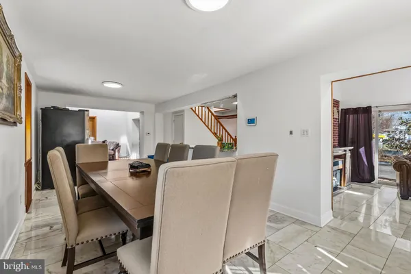 a dining room with furniture and window