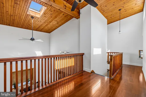 a view of hallway with wooden floor