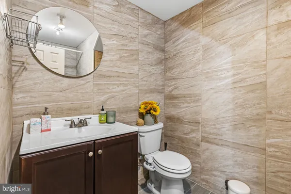 a bathroom with a sink mirror toilet and mirror