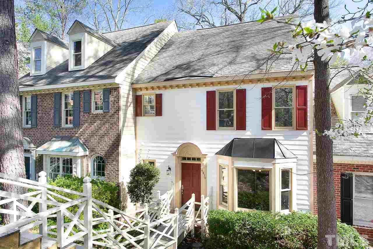 6830 Gloucester Road Raleigh, NC 27612 - Photo 1 of 28 a front view of a house with a yard