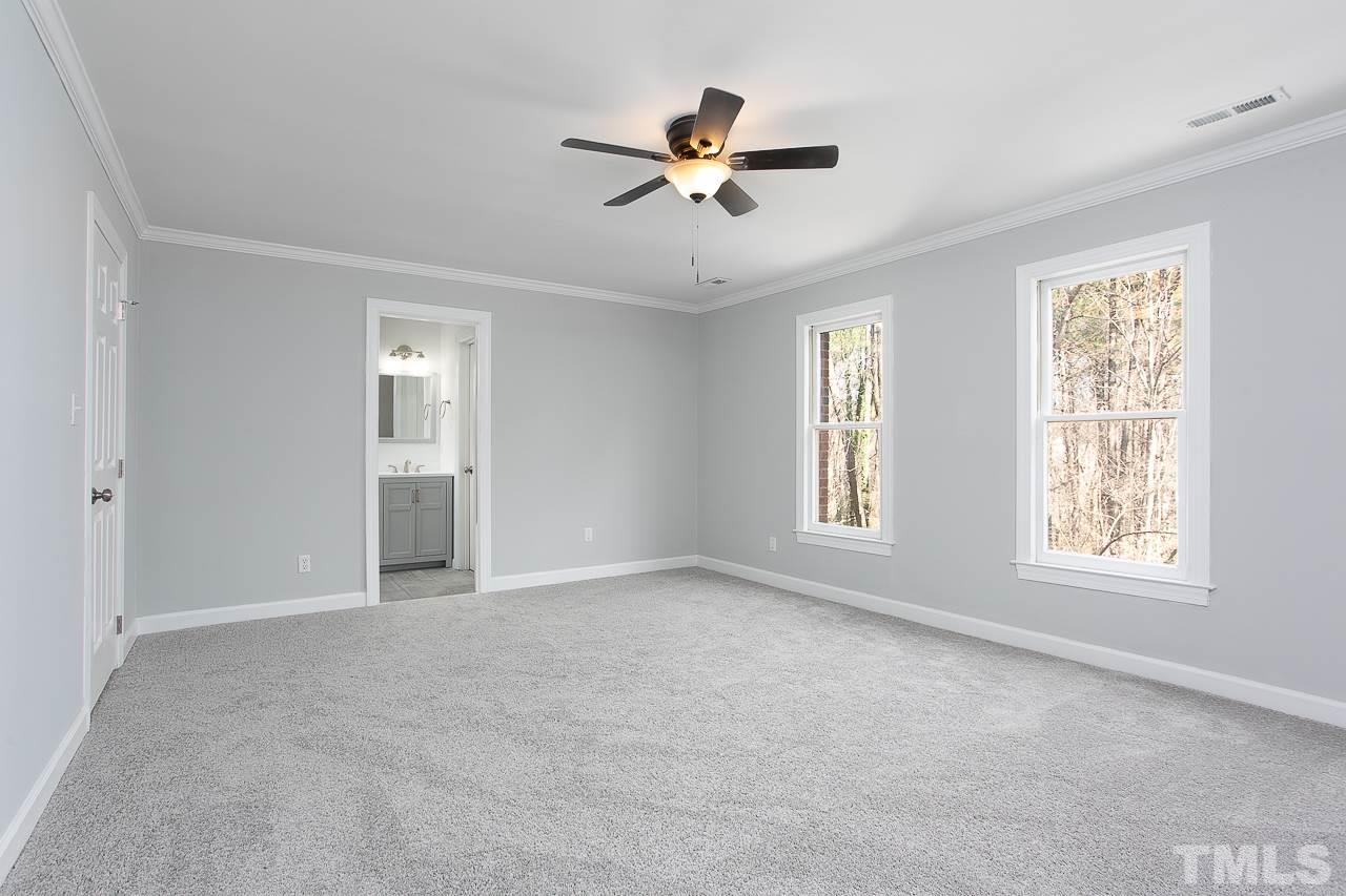 6830 Gloucester Road Raleigh, NC 27612 - Photo 17 of 28 a view of an empty room with a window