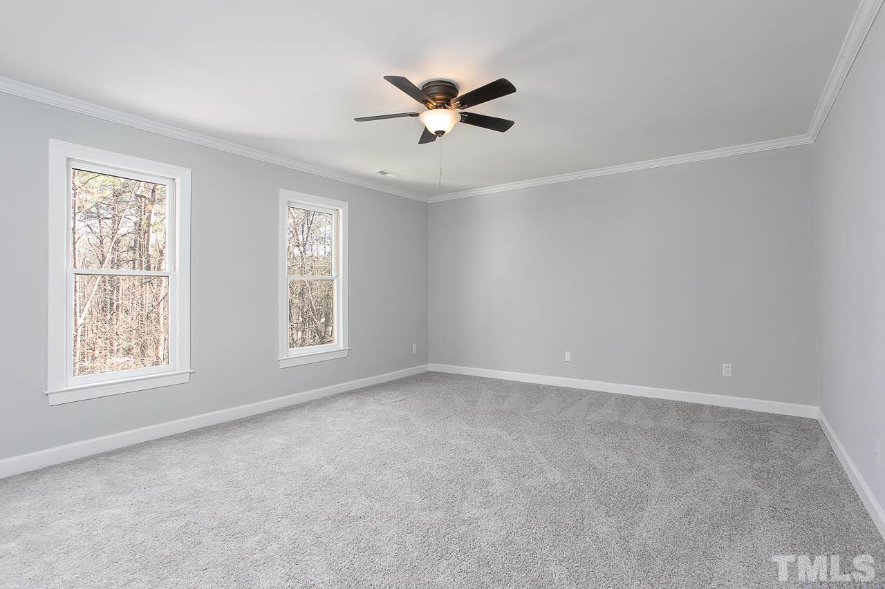 6830 Gloucester Road Raleigh, NC 27612 - Photo 18 of 28 a view of an empty room with a window