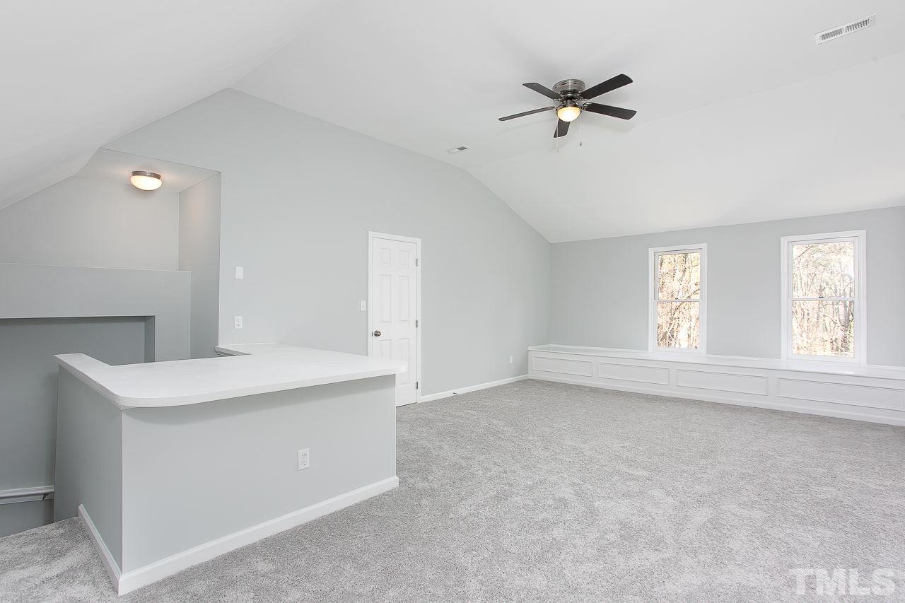6830 Gloucester Road Raleigh, NC 27612 - Photo 21 of 28 a view of an empty room with a window