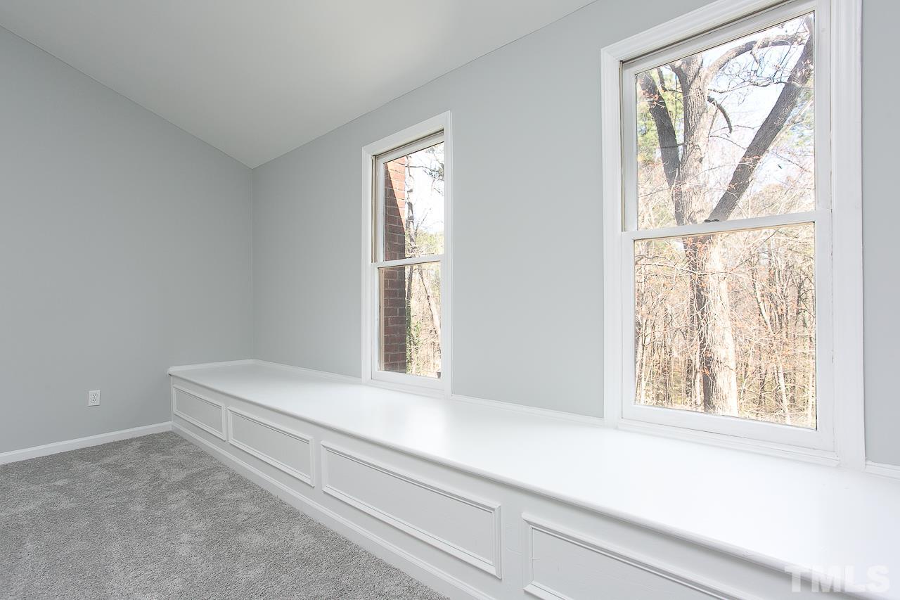 6830 Gloucester Road Raleigh, NC 27612 - Photo 23 of 28 a living room with a large window