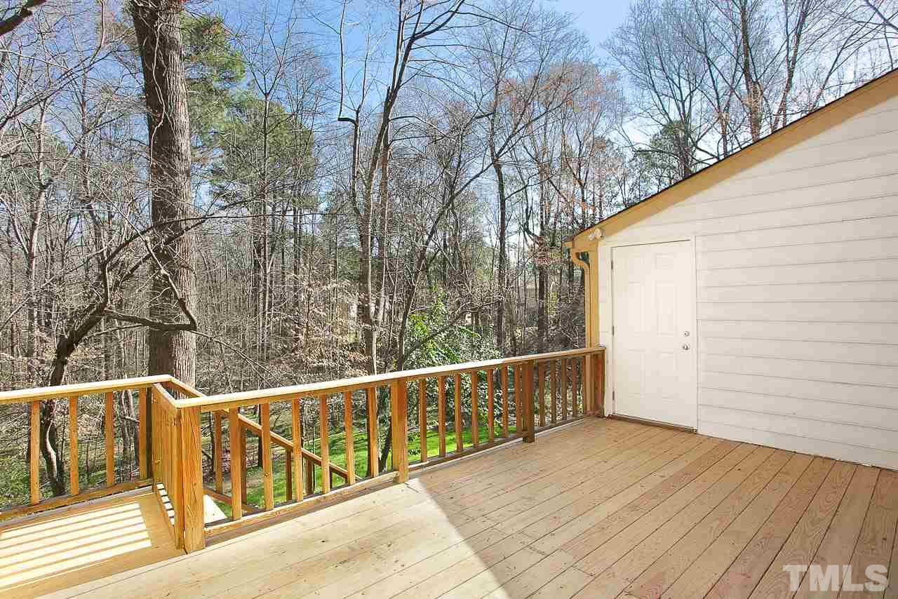 6830 Gloucester Road Raleigh, NC 27612 - Photo 25 of 28 a view of balcony with wooden floor and fence