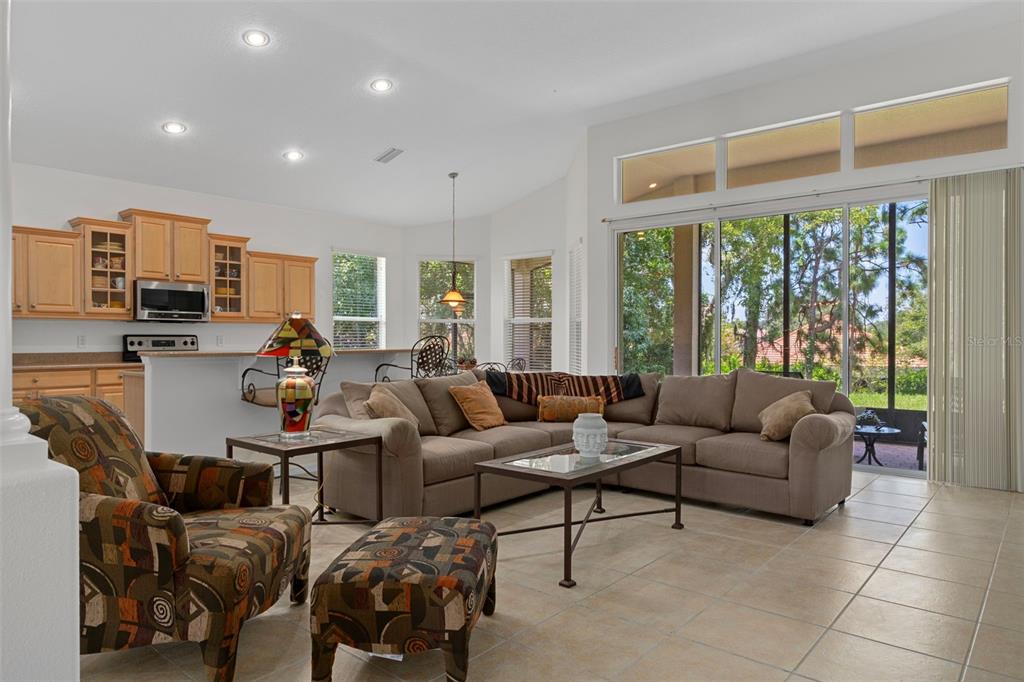 1031 West Diamond Shore Loop, Unit 5 Hernando, FL 34442 - Photo 16 of 69 a living room with furniture and large windows