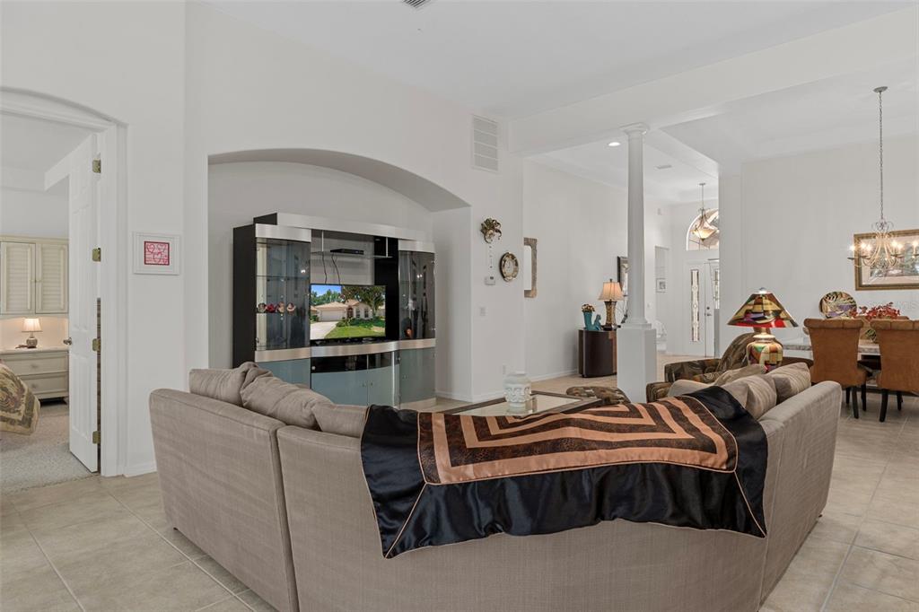 1031 West Diamond Shore Loop, Unit 5 Hernando, FL 34442 - Photo 19 of 69 a living room with furniture and a flat screen tv