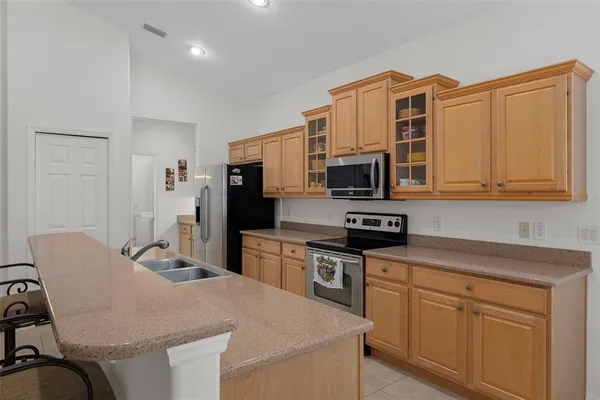 a view of a bathroom with a sink and mirror