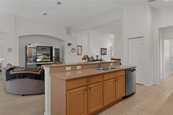 a bathroom with a granite countertop shower a sink and toilet