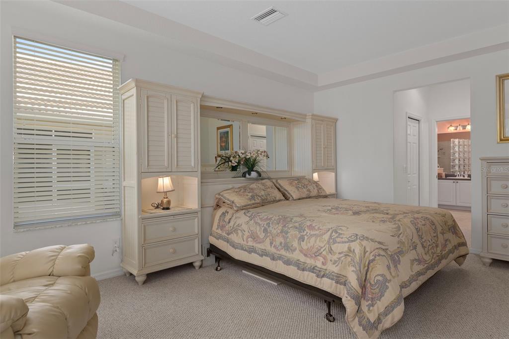 1031 West Diamond Shore Loop, Unit 5 Hernando, FL 34442 - Photo 27 of 69 a bedroom with a bed couch and windows