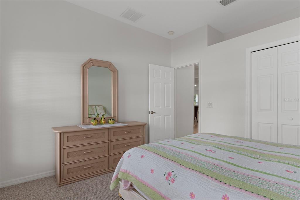 1031 West Diamond Shore Loop, Unit 5 Hernando, FL 34442 - Photo 34 of 69 a bedroom with a bed and a dresser