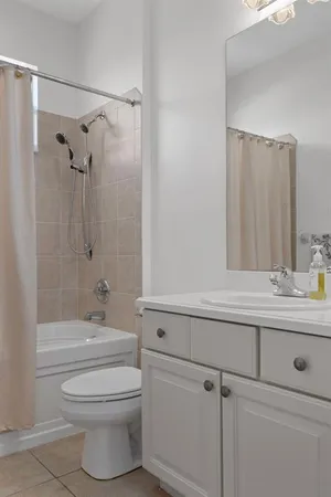 an aerial view of a house with a yard and garden