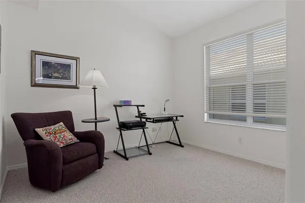 an aerial view of residential house with outdoor space and trees all around