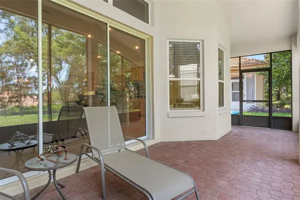 an aerial view of a house with a yard basket ball court and outdoor seating
