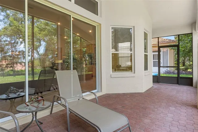 an aerial view of a house with a yard basket ball court and outdoor seating