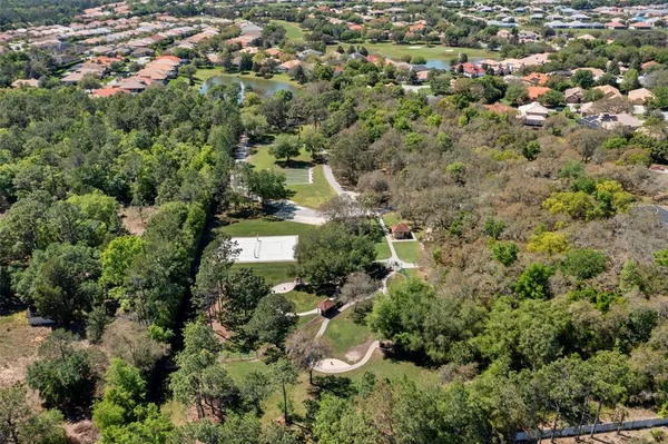 an aerial view of residential houses with outdoor space