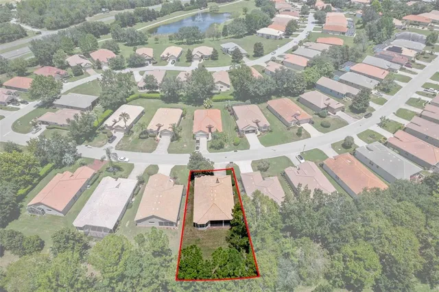 an aerial view of residential house with outdoor space and street view