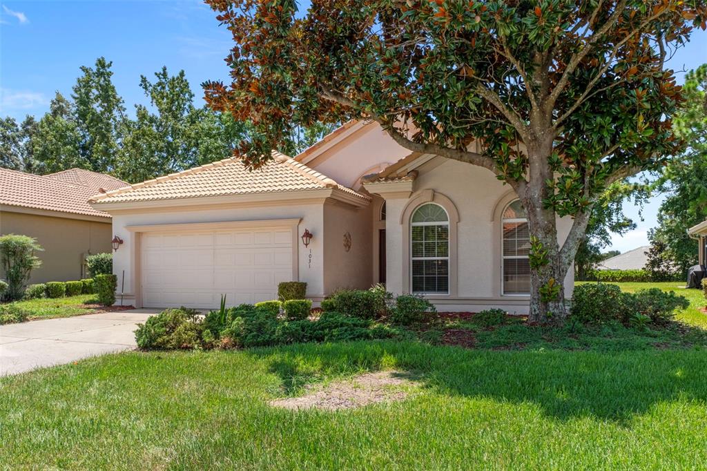 1031 West Diamond Shore Loop, Unit 5 Hernando, FL 34442 - Photo 8 of 69 a front view of a house with garden