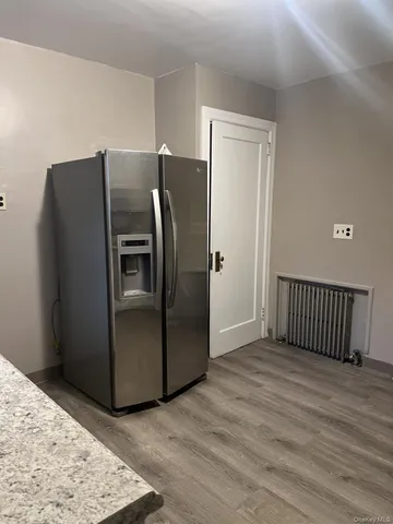 a refrigerator freezer sitting inside of a kitchen