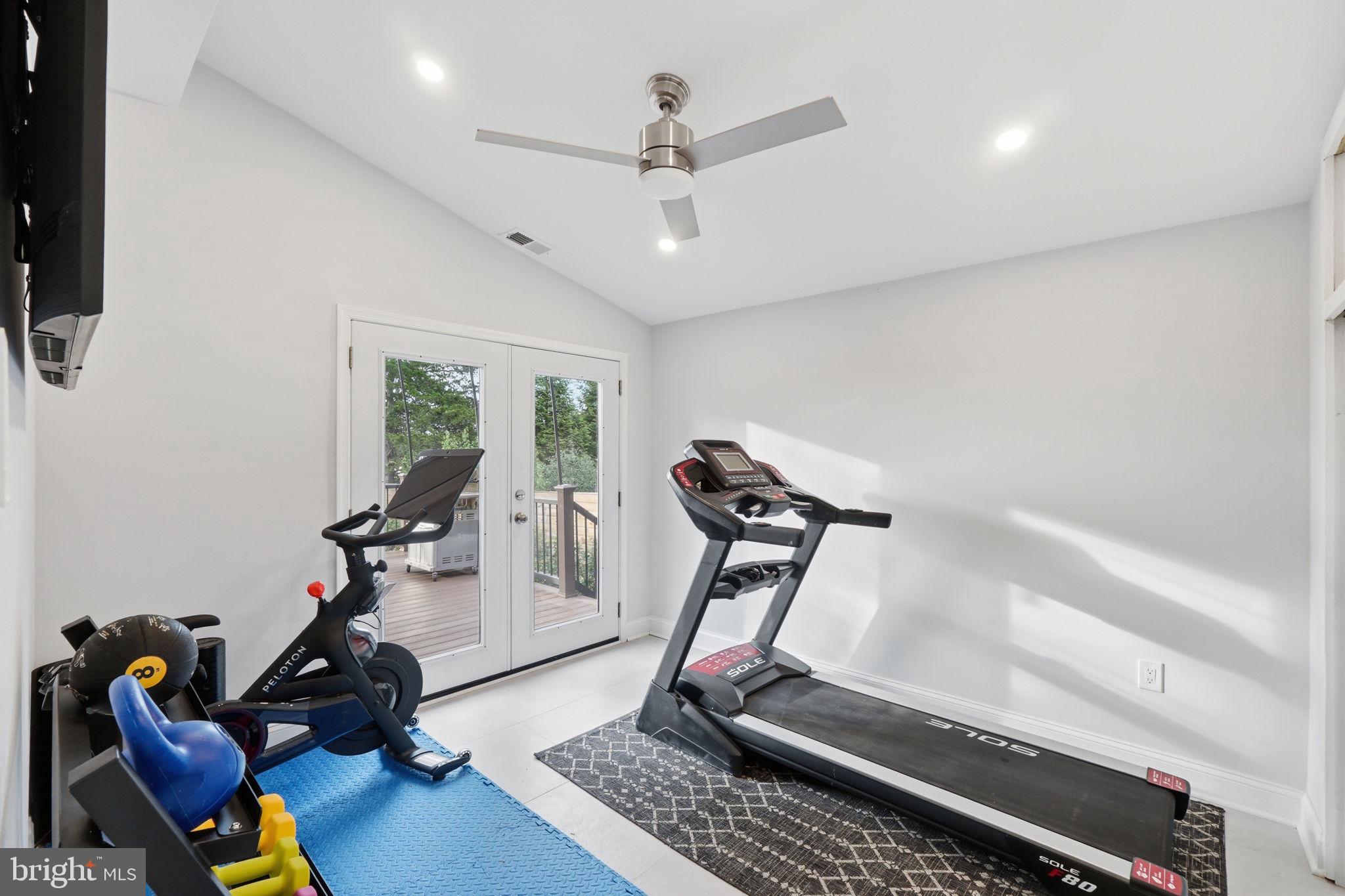 3311 Pendleton Drive Silver Spring, MD 20902 - Photo 13 of 45 a room with gym equipment and windows