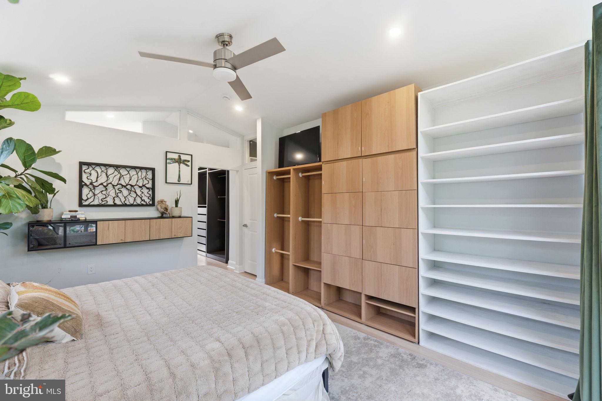 3311 Pendleton Drive Silver Spring, MD 20902 - Photo 25 of 45 a spacious bedroom with a bed and a walk in closet