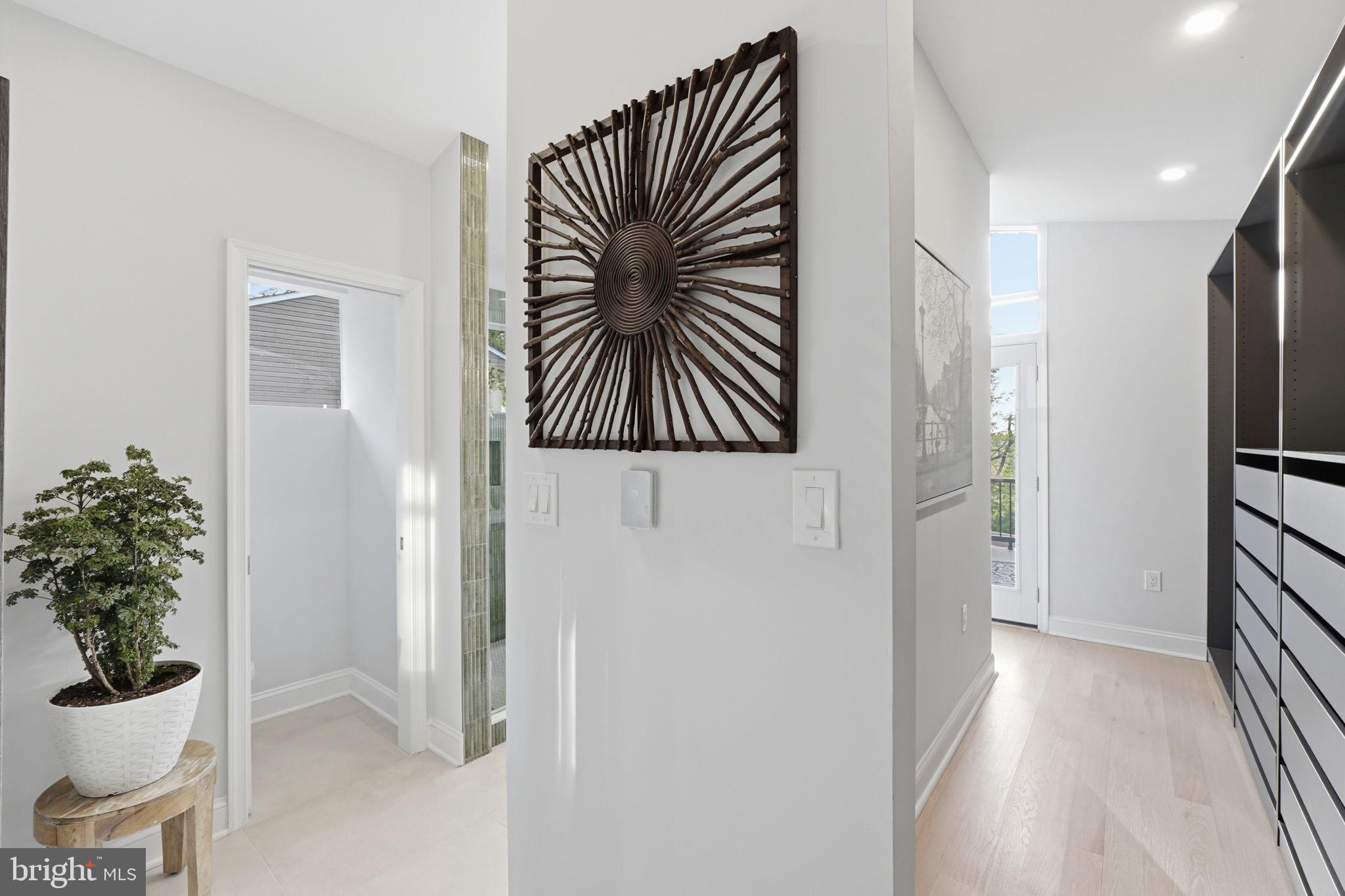 3311 Pendleton Drive Silver Spring, MD 20902 - Photo 26 of 45 a view of a hallway with wooden floor and a potted plant