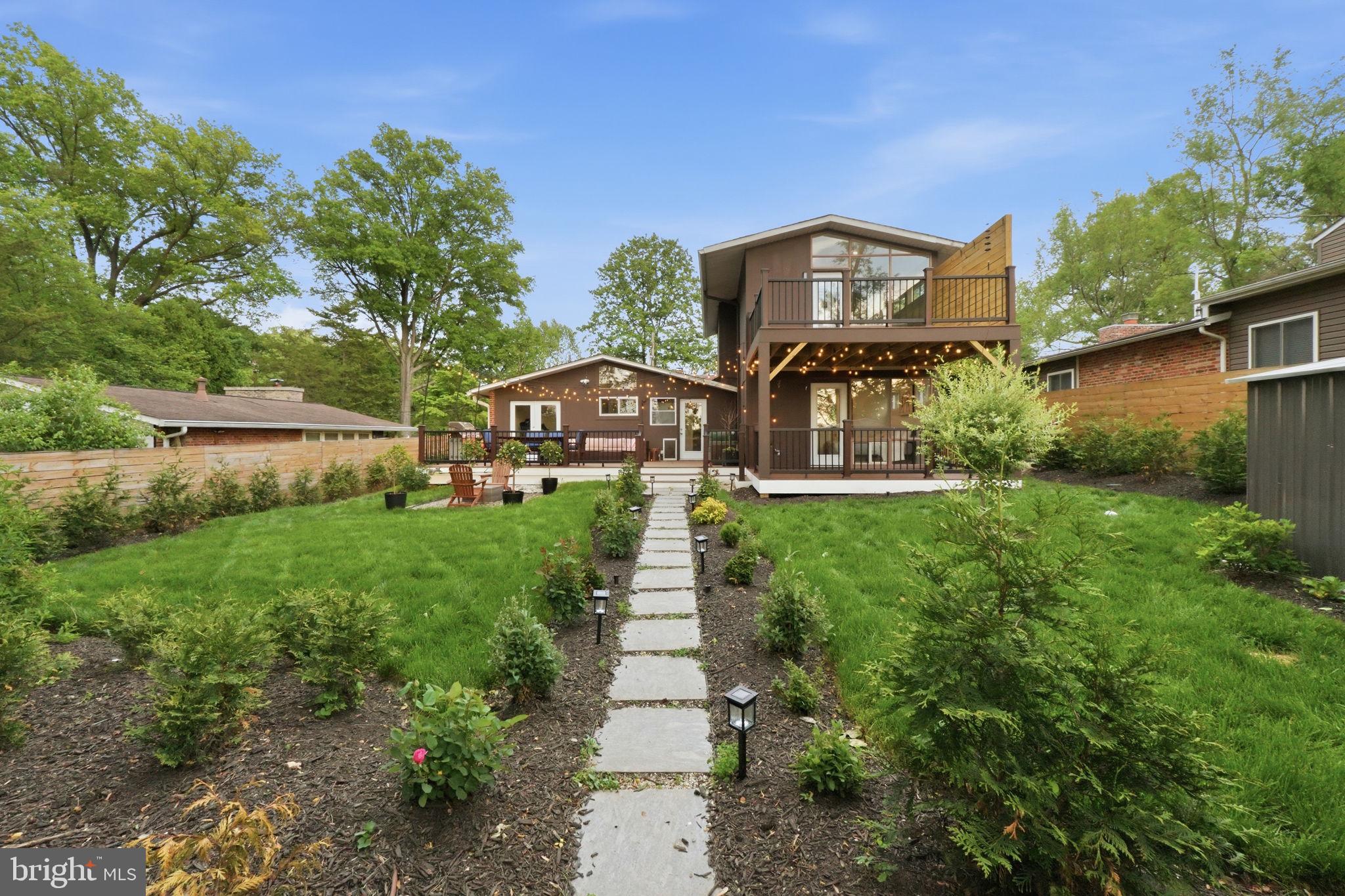 3311 Pendleton Drive Silver Spring, MD 20902 - Photo 36 of 45 a view of a brick house with a big yard plants and large trees