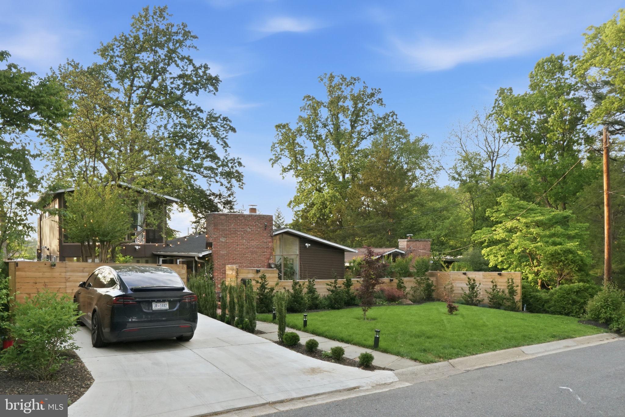 3311 Pendleton Drive Silver Spring, MD 20902 - Photo 45 of 45 a car parked in front of a house next to a yard
