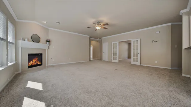 a view of an empty room with a fireplace