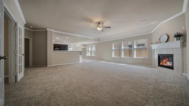 a view of empty room with a fireplace