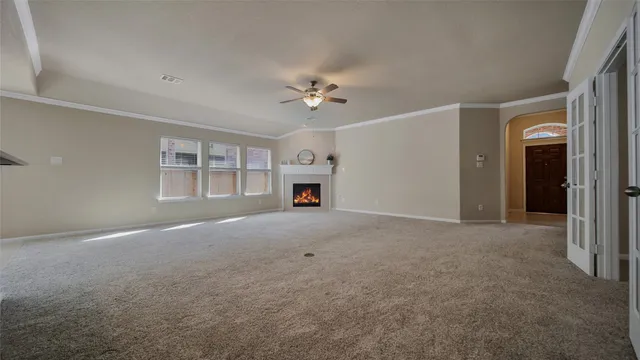 a furnished room with closet and windows
