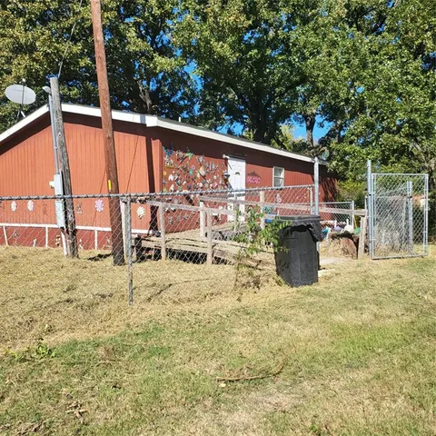 a view of a chairs and table in the patio
