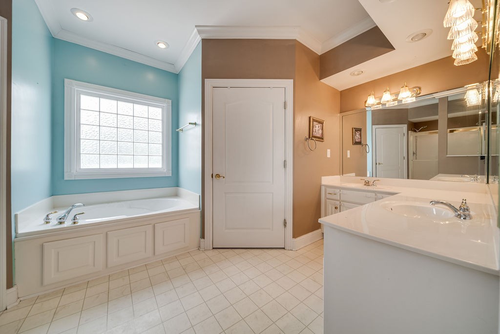 3377 Beckwith Road Mount Juliet, TN 37122 - Photo 14 of 50 a spacious bathroom with a bathtub sink and mirror