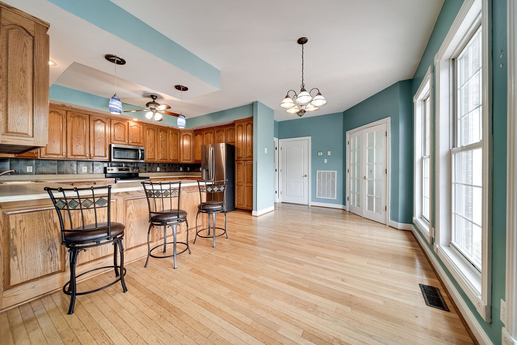 3377 Beckwith Road Mount Juliet, TN 37122 - Photo 8 of 50 a view of a dining room with furniture window and wooden floor