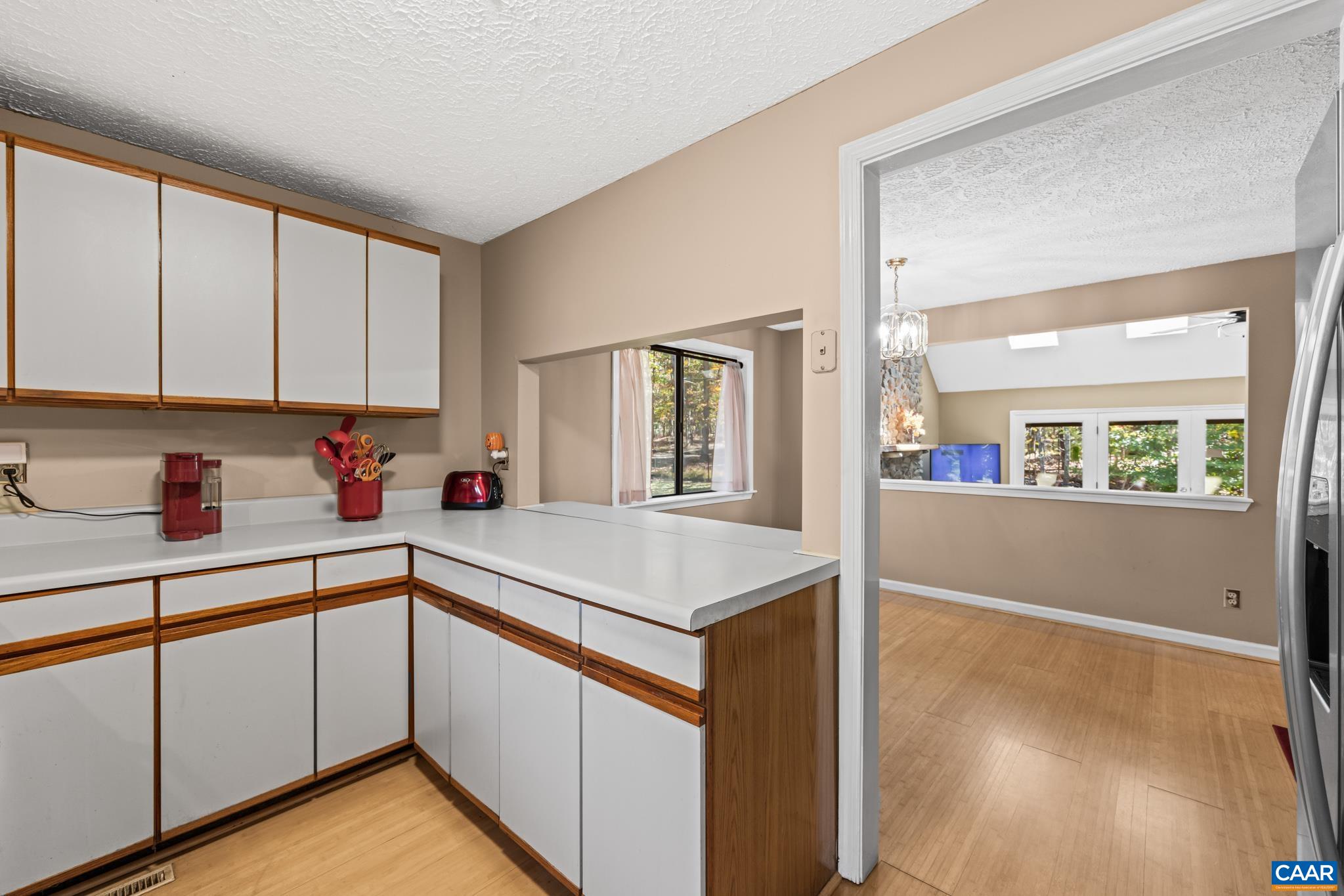 2530 Gillums Ridge Lane Charlottesville, VA 22903 - Photo 17 of 45 a kitchen that has a sink and a stove in it